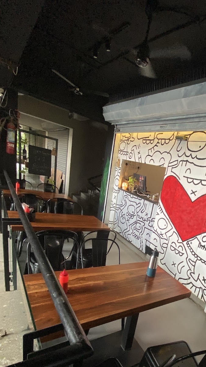 Seating at Hogger's Den beside the red heart doodle mural